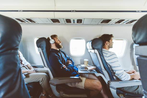 Passagers d'un avion en train de dormir